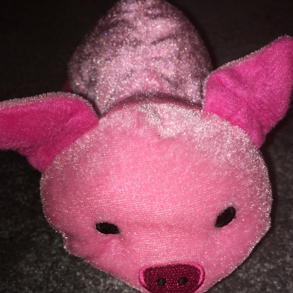 A small pink pig stuffed animal